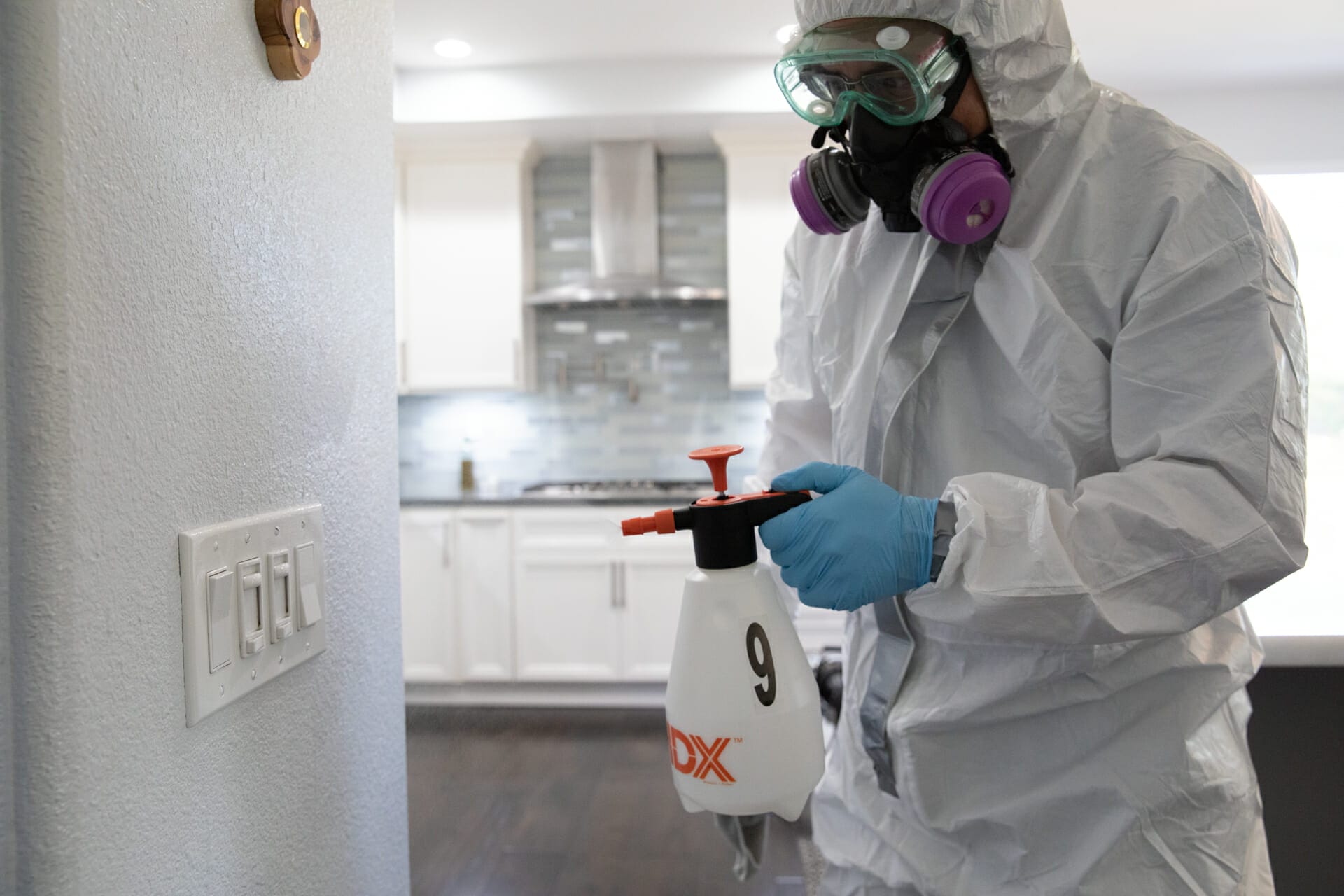 Biohazard remediation technician in hazmat